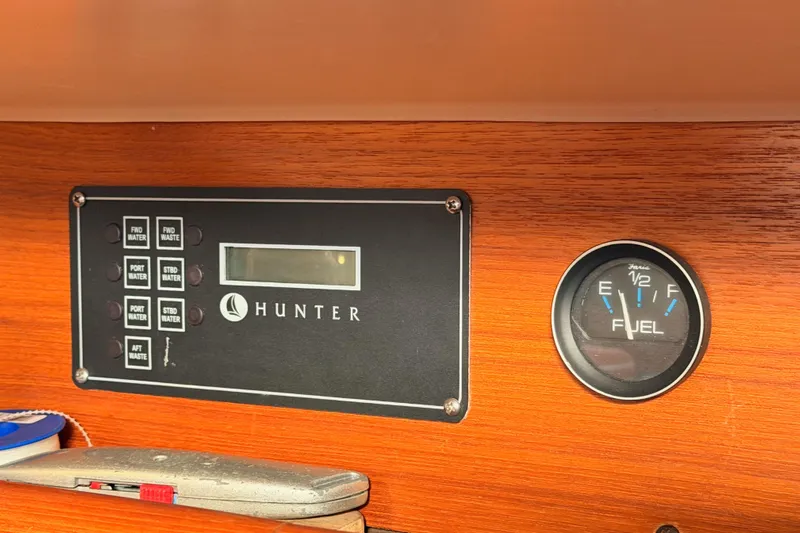 Serendipity II Yacht Photos Pics Control panel and fuel gauge on a 2002 Hunter 460 boat dashboard.