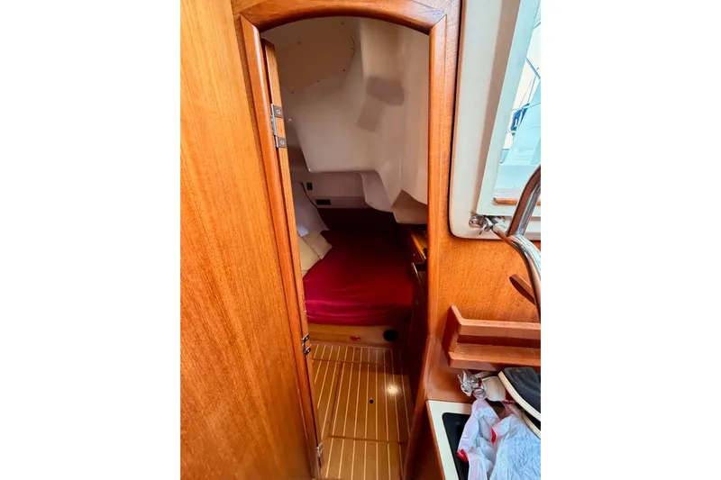 Serendipity II Yacht Photos Pics Interior cabin view of a 2002 Hunter 460 sailboat with wooden finish.