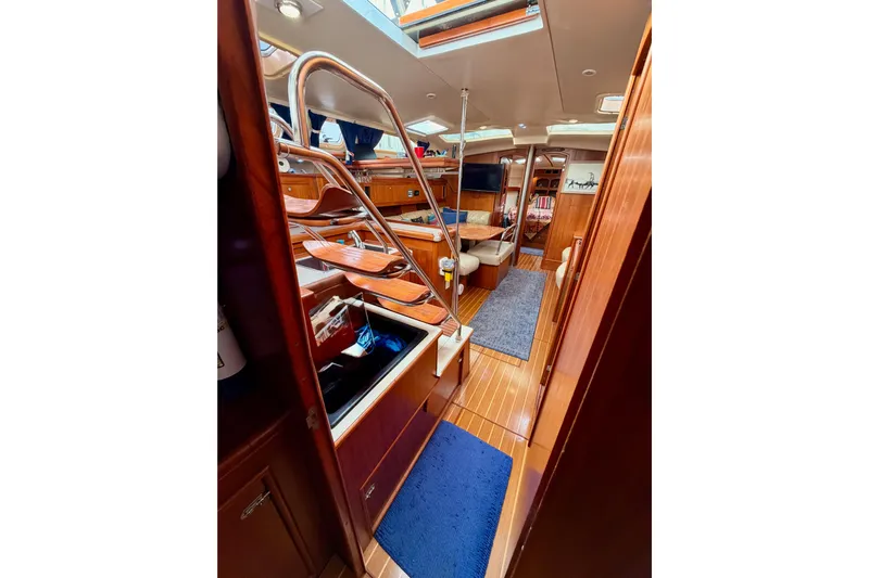 Serendipity II Yacht Photos Pics Interior of 2002 Hunter 460 sailboat with wooden finishes and modern amenities.
