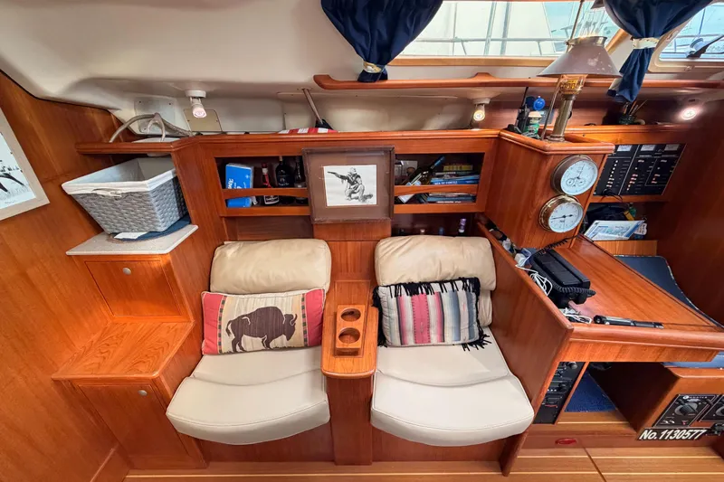 Serendipity II Yacht Photos Pics Interior of a 2002 Hunter 460 yacht with cozy seating and nautical decor.