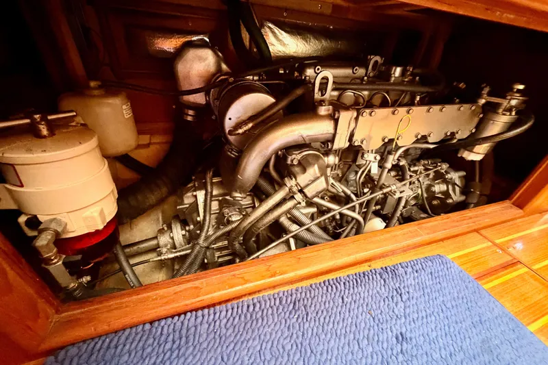 Serendipity II Yacht Photos Pics Engine compartment of a 2002 Hunter 460 sailboat, showcasing detailed mechanical components.