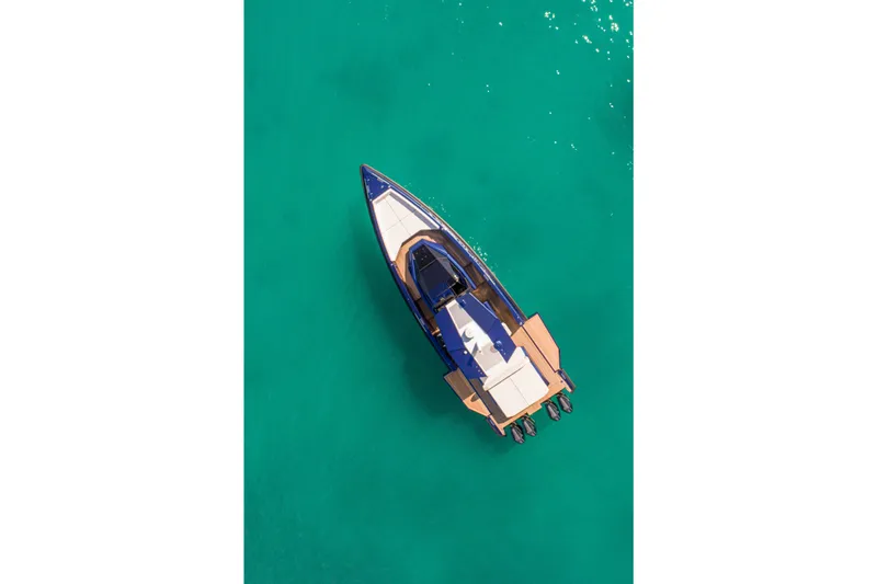 Rocket Yacht Photos Pics Aerial view of 2022 Wally Tender 48X yacht on turquoise water.