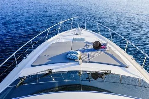  Yacht Photos Pics Ferretti Yachts 57, 2000 model, cruising on calm blue waters.