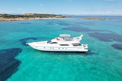  Yacht Photos Pics Luxury 2000 Ferretti Yachts 57 cruising in clear turquoise waters.