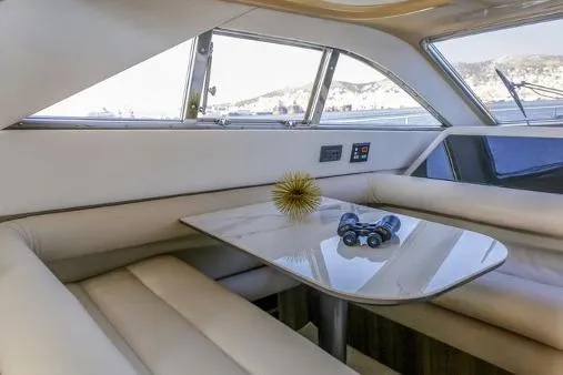 Yacht Photos Pics Luxurious interior of 2000 Ferretti Yachts 57 with elegant seating and table.