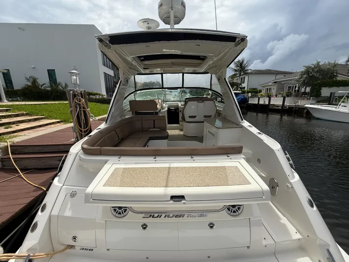  Yacht Photos Pics 2016 Sea Ray 350 Sundancer yacht docked, featuring spacious seating and sleek design.