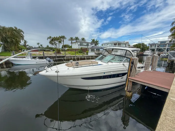  Yacht Photos Pics 2016 Sea Ray 350 Sundancer docked in a scenic marina setting.
