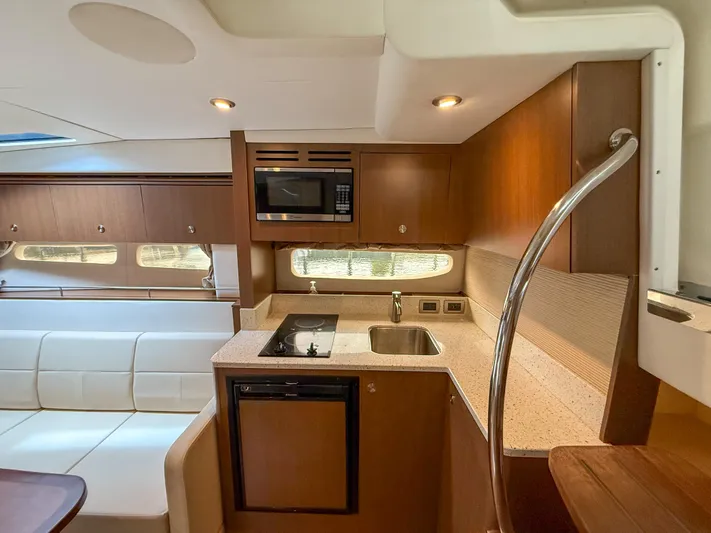  Yacht Photos Pics Interior of 2016 Sea Ray 350 Sundancer yacht with modern kitchen amenities.