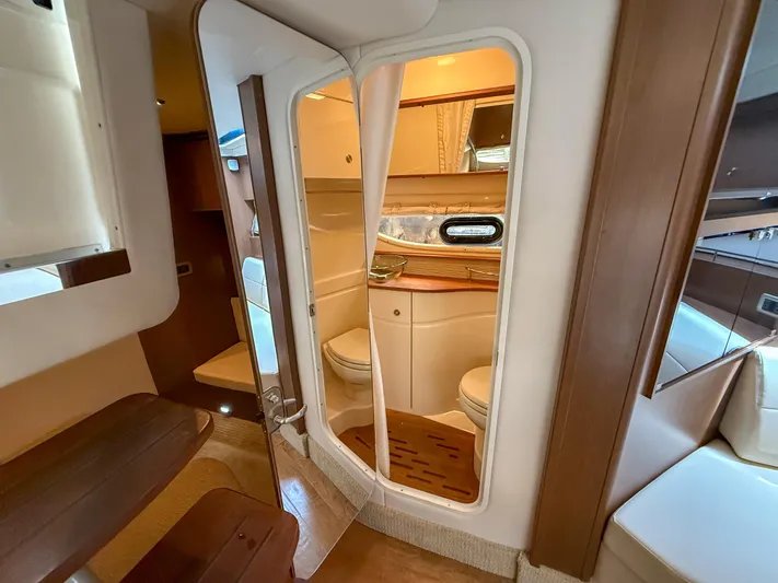  Yacht Photos Pics Interior of 2016 Sea Ray 350 Sundancer yacht, featuring a compact bathroom.
