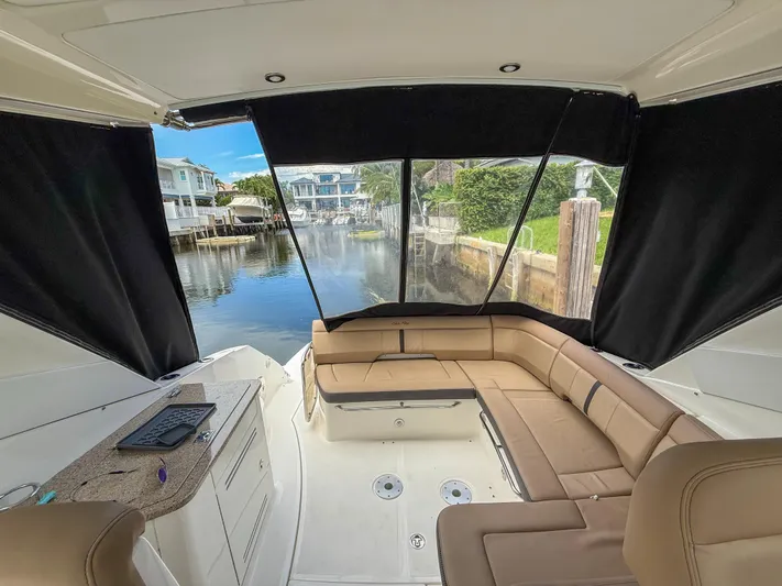 Yacht Photos Pics 2016 Sea Ray 350 Sundancer interior with tan seating and marina view.