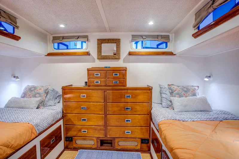 Huckins Yacht Corporation Yacht Photos Pics 1964 Huckins Out Islander 56 cabin with twin beds and wooden dresser.