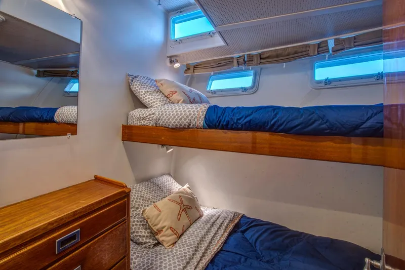 Huckins Yacht Corporation Yacht Photos Pics Bunk beds in 1964 Huckins Out Islander 56 yacht cabin with nautical decor.