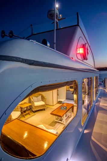 Huckins Yacht Corporation Yacht Photos Pics 1964 Huckins Out Islander 56 yacht at sunset, showcasing elegant interior and sleek exterior design.