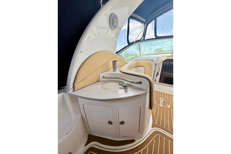  Yacht Photos Pics 2004 Sea Ray 320 Sundancer interior with sink and seating area.