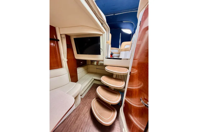 Yacht Photos Pics Interior of 2004 Sea Ray 320 Sundancer with elegant seating and wooden steps.