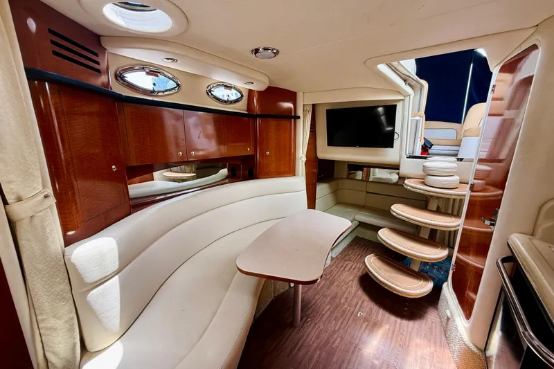  Yacht Photos Pics Luxurious interior of a 2004 Sea Ray 320 Sundancer yacht with elegant seating and modern amenities.