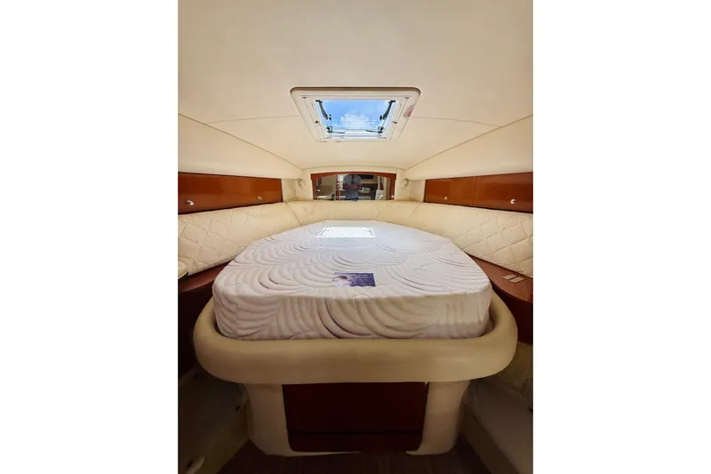  Yacht Photos Pics Luxurious cabin interior of 2004 Sea Ray 320 Sundancer yacht with plush bedding.