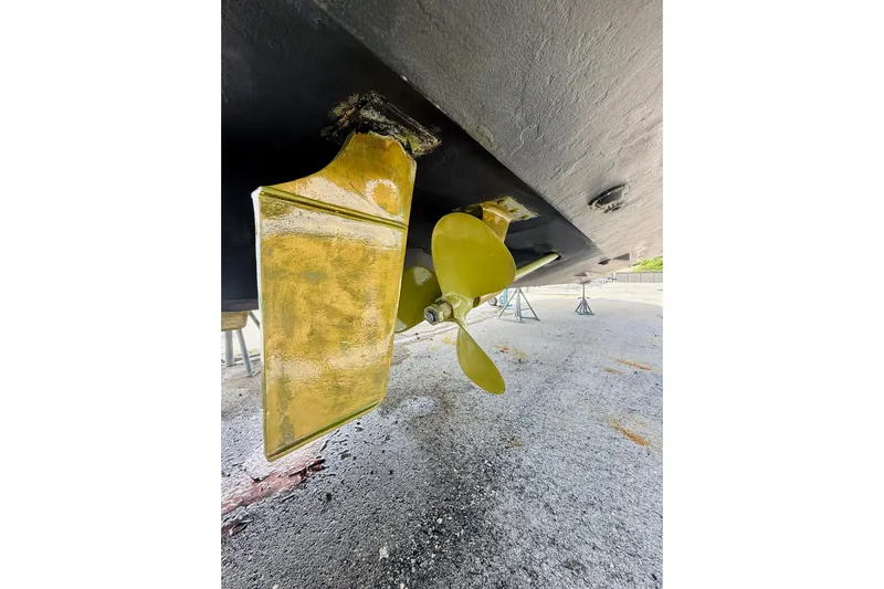  Yacht Photos Pics Close-up of 2004 Sea Ray 320 Sundancer propeller and rudder on dry dock.