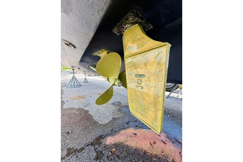  Yacht Photos Pics Close-up of 2004 Sea Ray 320 Sundancer propeller and rudder on dry dock.