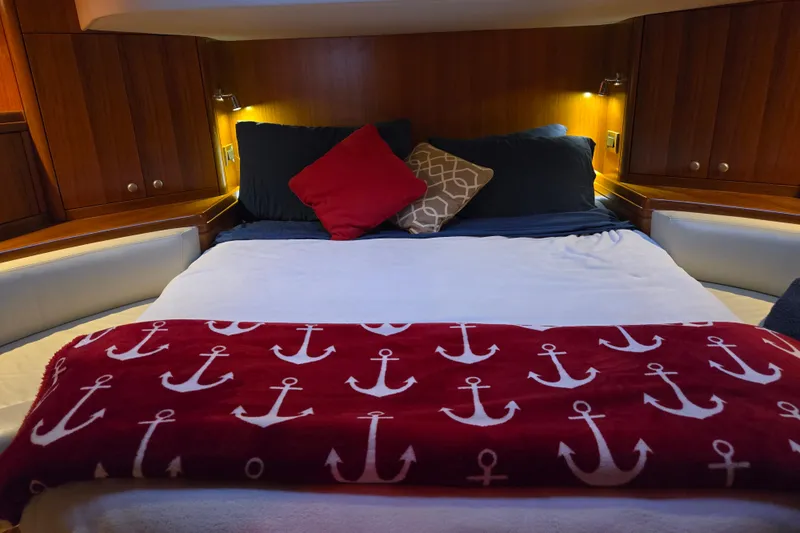 Kolea Yacht Photos Pics Cozy yacht cabin with anchor-themed blanket, Ron Holland 50, 2013 model.