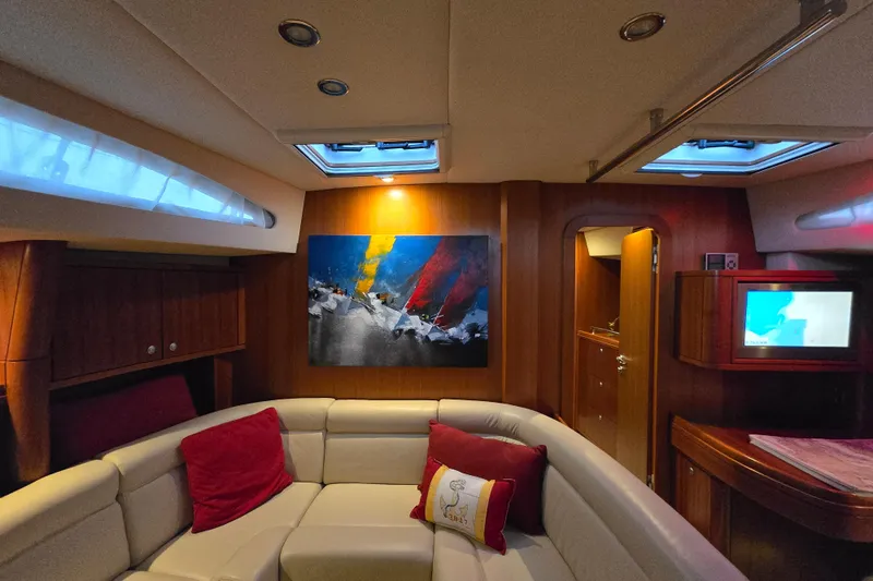 Kolea Yacht Photos Pics Luxurious interior of 2013 Ron Holland 50 yacht with modern art and cozy seating.