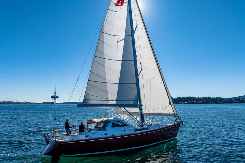 Kolea Yacht Photos Pics Sailing yacht Ron Holland 50, 2013 model, gliding on clear blue waters under sunny skies.