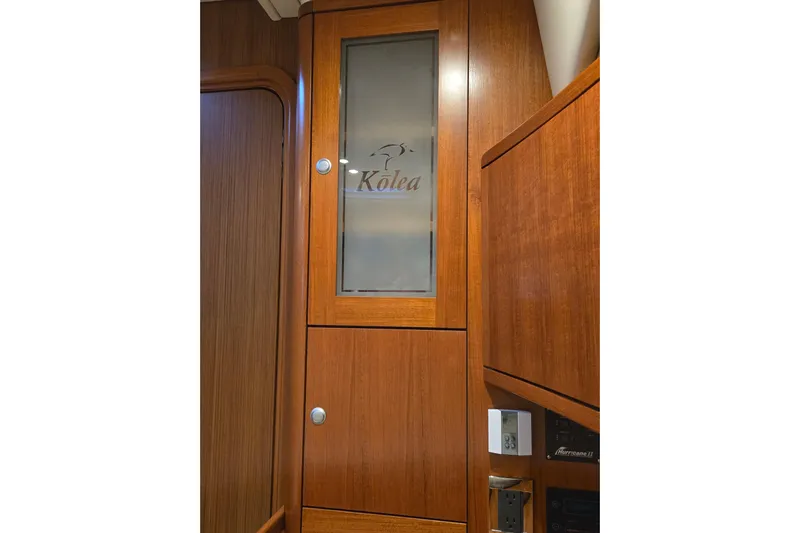 Kolea Yacht Photos Pics Wooden interior of 2013 Ron Holland 50 yacht with frosted glass cabinet.
