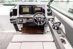 True Yacht Photos Pics 2020 Cruisers Yachts 38 GLS helm with modern controls and navigation screens.