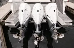 True Yacht Photos Pics Triple outboard engines on a 2020 Cruisers Yachts 38 GLS at a dock.