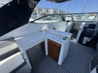 True Yacht Photos Pics 2020 Cruisers Yachts 38 GLS interior with kitchenette and seating area.