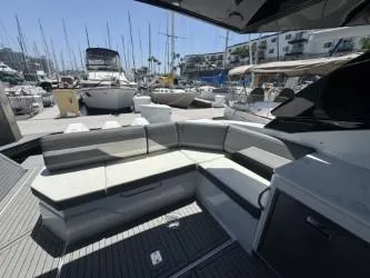 True Yacht Photos Pics 2020 Cruisers Yachts 38 GLS with sleek seating, docked in a marina.