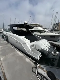 True Yacht Photos Pics 2020 Cruisers Yachts 38 GLS docked, showcasing sleek design and powerful engines.