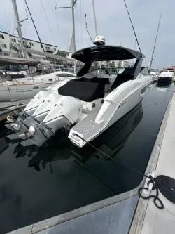 True Yacht Photos Pics 2020 Cruisers Yachts 38 GLS docked, showcasing sleek design and powerful engines.