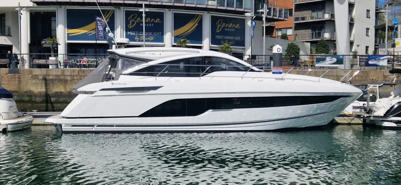 Seakeeper Gyro Yacht Photos Pics 2022 Fairline Targa 45 GT yacht docked in a marina, side view.