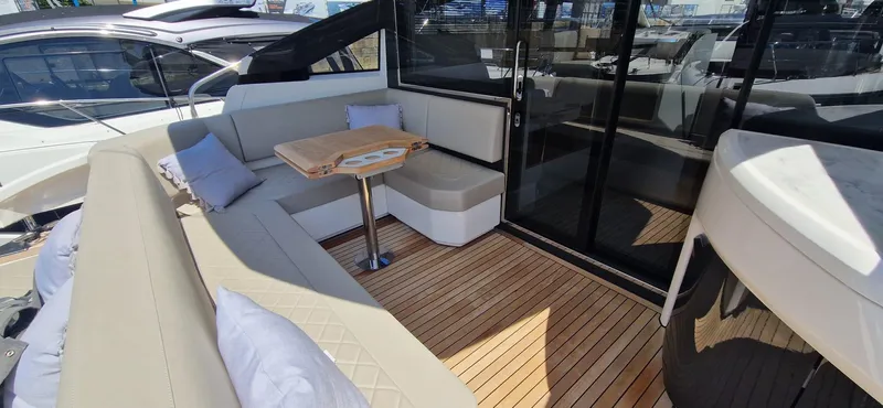 Seakeeper Gyro Yacht Photos Pics Luxury seating area on 2022 Fairline Targa 45 GT yacht with elegant wood flooring.
