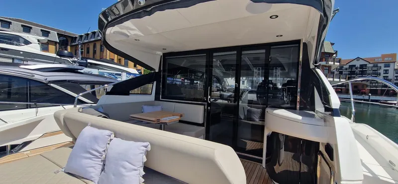 Seakeeper Gyro Yacht Photos Pics 2022 Fairline Targa 45 GT yacht with spacious deck and modern design in marina setting.