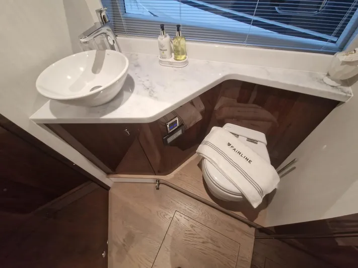 Seakeeper Gyro Yacht Photos Pics Luxury bathroom in 2022 Fairline Targa 45 GT yacht with modern sink and toilet.