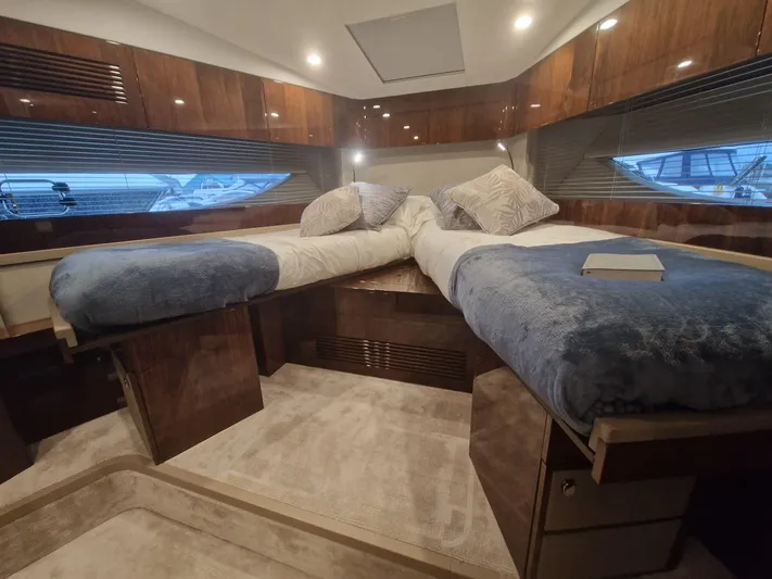Seakeeper Gyro Yacht Photos Pics Luxurious 2022 Fairline Targa 45 GT cabin with twin beds and elegant wood finishes.