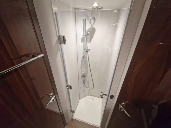 Seakeeper Gyro Yacht Photos Pics Shower area in 2022 Fairline Targa 45 GT yacht, featuring sleek glass doors and modern fixtures.
