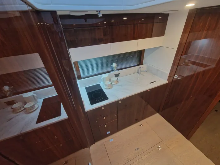 Seakeeper Gyro Yacht Photos Pics Luxurious kitchen interior of 2022 Fairline Targa 45 GT yacht with modern amenities.