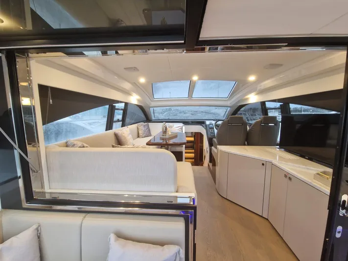 Seakeeper Gyro Yacht Photos Pics Luxurious interior of 2022 Fairline Targa 45 GT yacht with modern seating and panoramic windows.