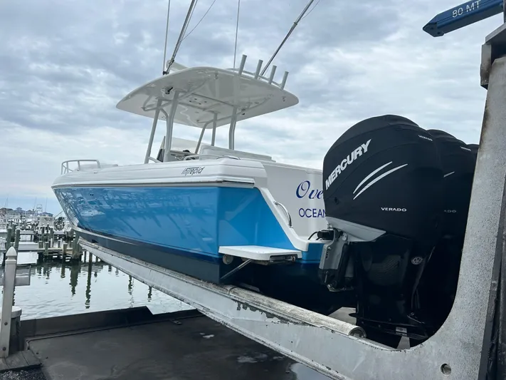 Overboard Yacht Photos Pics 2005 Intrepid 370 Cuddy boat with Mercury Verado engines on a lift.