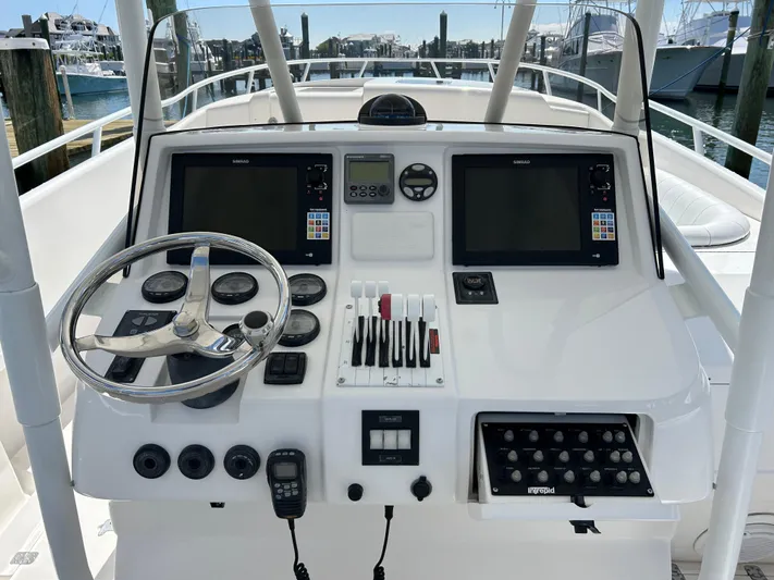 Overboard Yacht Photos Pics Helm of a 2005 Intrepid 370 Cuddy boat with navigation equipment and controls.