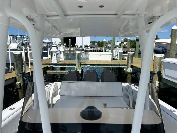 Overboard Yacht Photos Pics 2005 Intrepid 370 Cuddy at a marina dock, view from the helm.