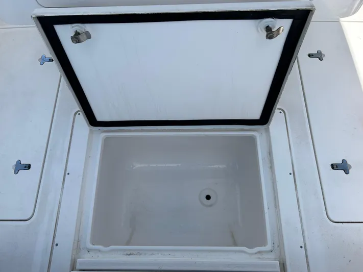 Overboard Yacht Photos Pics Open storage compartment on a 2005 Intrepid 370 Cuddy boat.