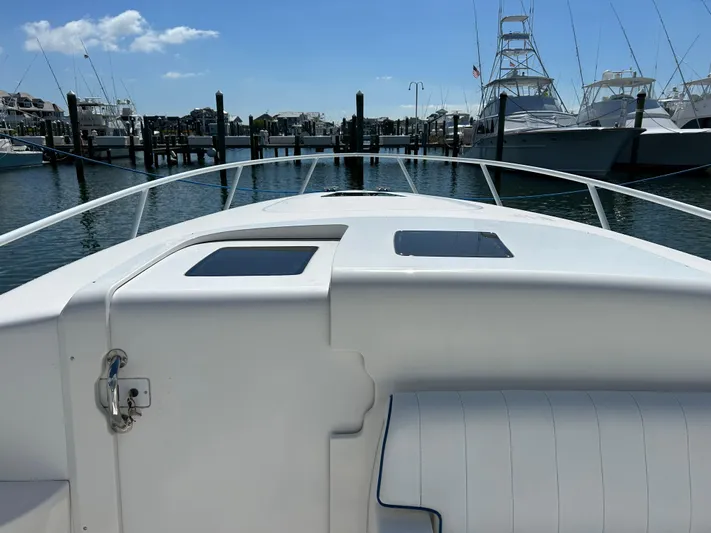 Overboard Yacht Photos Pics View from the deck of a 2005 Intrepid 370 Cuddy boat docked at a marina.