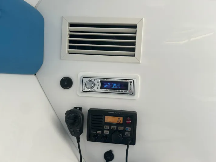 Overboard Yacht Photos Pics Control panel of a 2005 Intrepid 370 Cuddy boat with radio and air vent.