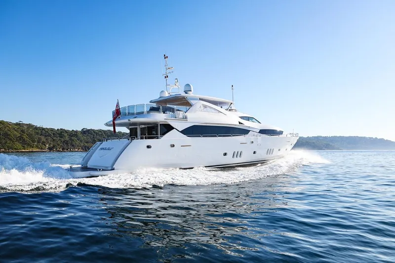 Frivolous Yacht Photos Pics Sunseeker 34 Metre Yacht 2009 cruising on calm blue waters under clear sky.