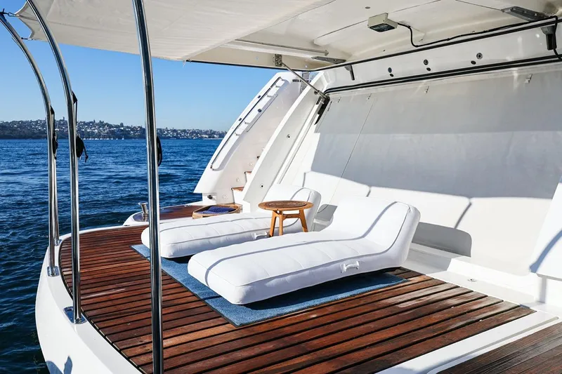 Frivolous Yacht Photos Pics Luxury Sunseeker 34 Metre Yacht 2009 with sun loungers on deck, ocean view.