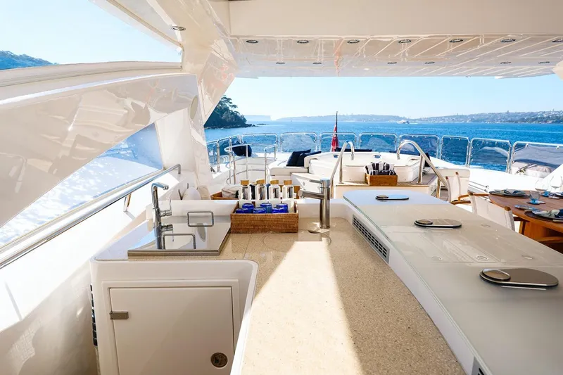 Frivolous Yacht Photos Pics Luxurious Sunseeker 34 Metre Yacht 2009 with elegant outdoor bar and ocean view.